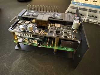 a raspberry pi 5 on its tray before installing it in the kuberenetes cluster inside the 10-inch rack